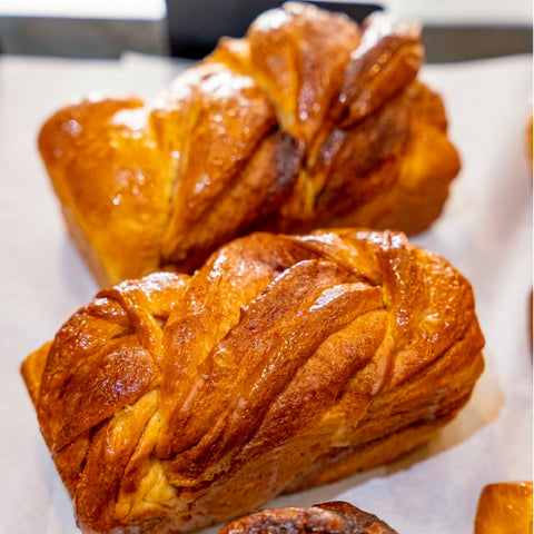 Cinnamon Babka Cake with layers of soft dough and a rich cinnamon sugar swirl, crafted by Chef Nir Netzer & Happy Grocers in Bangkok. 